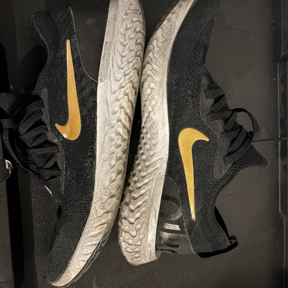 Nike Athletic Shoes Black with Gold Swoosh